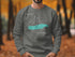 Gray sweatshirt with "Beautiful Donner Lake California" text and compass graphic.