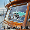 Teal map sticker with "Choke Canyon Life" on boat window, "Lake Lodge Media" logo below.