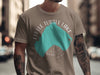 T-shirt with a teal map outline of Little Turtle Lake, Minnesota