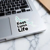 East Lynn Life sticker with turquoise wave pattern on a laptop.