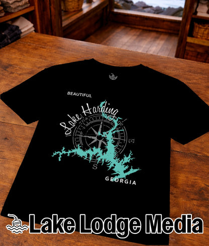 Black t-shirt with Lake Harding map and compass graphic, "Lake Lodge Media" text.