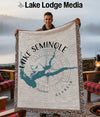 Tapestry blanket with Lake Seminole map and compass design, fringed edges.