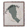 Woven throw blanket featuring a Pyramid Lake shape and "Nevada" text.