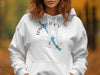 White hoodie with "Longboat Key Florida" text and a compass graphic featuring a blue map outline.