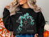 Black sweatshirt with "Pond de Terre Lakes" map and compass design.