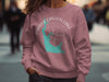 Pink crewneck sweatshirt with turquoise Parker Canyon Lake outline and compass.