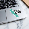 Teal lake outline sticker with "Pavlas Life" text on a laptop.