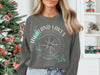Gray sweatshirt with compass graphic and "Highland Lakes Texas" text.