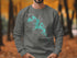Crewneck sweatshirt featuring an Evergreen Lake map and compass design.