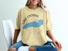 Light yellow t-shirt with Lake Ontario map and compass graphic and "CANADA" text.