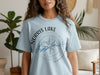 Light blue t-shirt with a compass graphic showing Norris Lake, Tennessee.