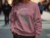 Pink crewneck sweatshirt with Lake Oconee Georgia compass graphic.
