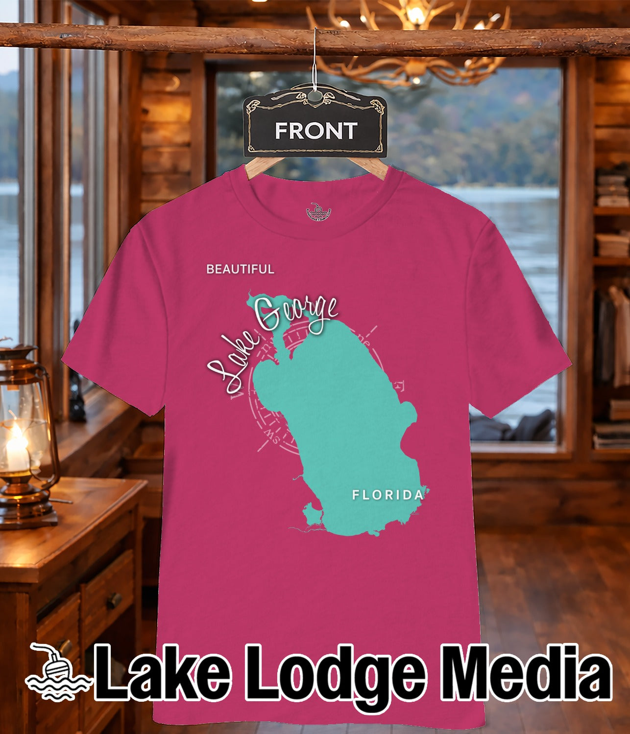 Teal Lake George outline on a pink t-shirt with "FRONT" tag above.