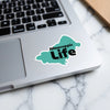 Turquoise sticker with black text "Mascuppic Life" on a laptop.