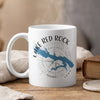 White mug with "Lake Red Rock Iowa" text, a blue lake map, and compass rose.