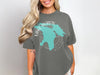 Dark grey t-shirt featuring a teal map outline of Lake Huron and Michigan.