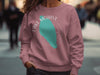 Rose sweatshirt with turquoise Lake Mohave graphic and compass detail.