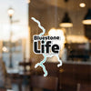 Bluestone Life sticker with turquoise outline on a glass surface.