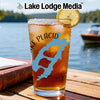 Glass of iced tea with a lemon slice, featuring a blue Lake Placid map design.