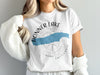 White t-shirt with "Donner Lake California" text, a blue lake outline, and compass graphic.
