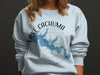 Light blue sweatshirt with a blue map outline of Lake Cachuma, California and compass rose.
