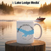 White mug with "Harlan County Lake Nebraska" and lake outline on misty lake background.
