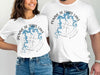 White t-shirts feature blue lake outline on compass rose with "Pomme de Terre Lake Missouri" text.