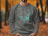 Gray sweatshirt with "Beautiful Lake Texoma Texas" and compass rose design.