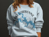 Light blue sweatshirt with Lake D'Arbonne map and compass rose.