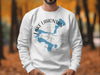 White sweatshirt with Lake Lahontan, Nevada map and compass graphic
