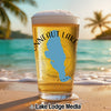 Glass of beer with "Conneaut Lake" and Pennsylvania outline on a beach.