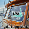 Thunderbird Life sticker with lake outline on boat window, Lake Lodge Media text logo.