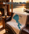 Throw blanket with Clear Lake California map design on leather couch.