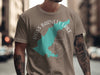 Brown t-shirt with a turquoise outline of Ross Barnett Lake and compass on the front.