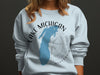Light blue sweatshirt with Lake Michigan map and compass graphic.