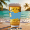 Glass of beer with "Nasquan Reservoir New Jersey" text and a blue map overlay on a beach.