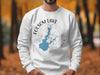 White sweatshirt with Folsom Lake California map and compass design.