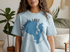 Light blue t-shirt with Sebago Lake Maine graphic and compass design.