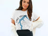 White t-shirt with blue Lake Jacomo map and compass design