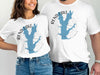 White t-shirts feature blue Rend Lake map with compass and text.