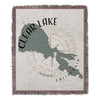 Woven throw with Clear Lake California map and compass design.
