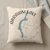 Cream pillow with blue Abraham Lake map and compass design, "Alberta" text.