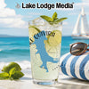 Glass with drink, limes, mint, and "Lake Quivira" graphic on beach background.