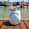 White stainless steel tumbler with an Onondaga Lake New York design sitting on a wooden boat deck.