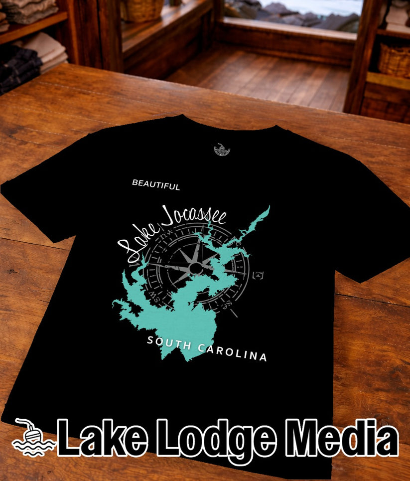 Black t-shirt with a teal Lake Jocassee outline and compass rose.