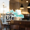 DeGray Life sticker with turquoise outline of trees and a watermark.