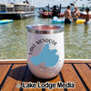 A white insulated travel tumbler with a Lake Mendota map design sits on a wooden dock with a lake and boats in the background.