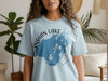 Light blue t-shirt with "INDIAN LAKE OHIO" text and lake map graphic.