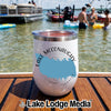 White insulated wine tumbler with Lake McConaughy logo on a wooden boat deck.