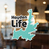 Teal map outline sticker with "Hayden Life" text on glass.